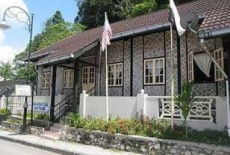 Отель Puncak Inn Bungalows в городе Фрейзерс Хилл, Малайзия