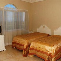 Отель Retreat Guesthouse Luxury Suites в городе Фолмут, Ямайка
