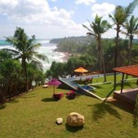 Отель UTMT - Underneath The Mango Tree Spa & Beach Resort в городе Диквелла, Шри-Ланка
