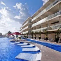 Отель El Dorado Seaside Suites Puerto Aventuras в городе Кспу-Ха, Мексика