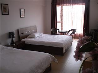 Xishuangbanna Shangcheng Apartment Hotel